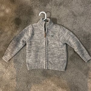 Carters zip up sweater.  Gray with green emblem. Size 4T.